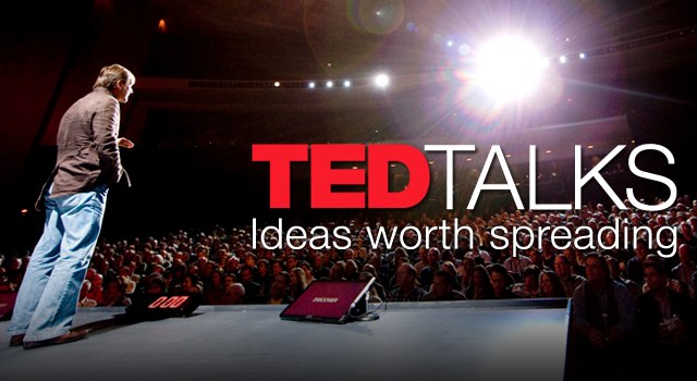 TED Talk speaker on stage with TED Talks logo